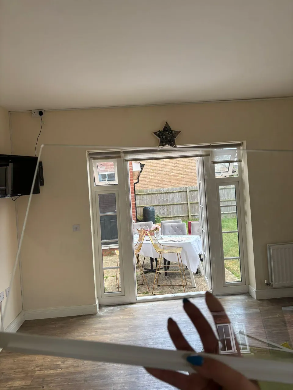 Living room with patio doors and freshly cleaned floor