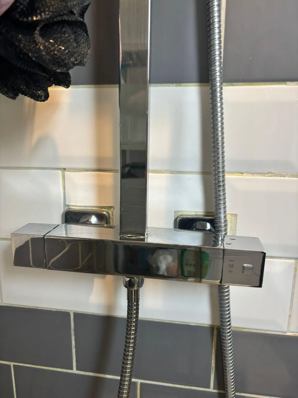 Chrome thermostatic shower bar and riser rail cleaned and polished