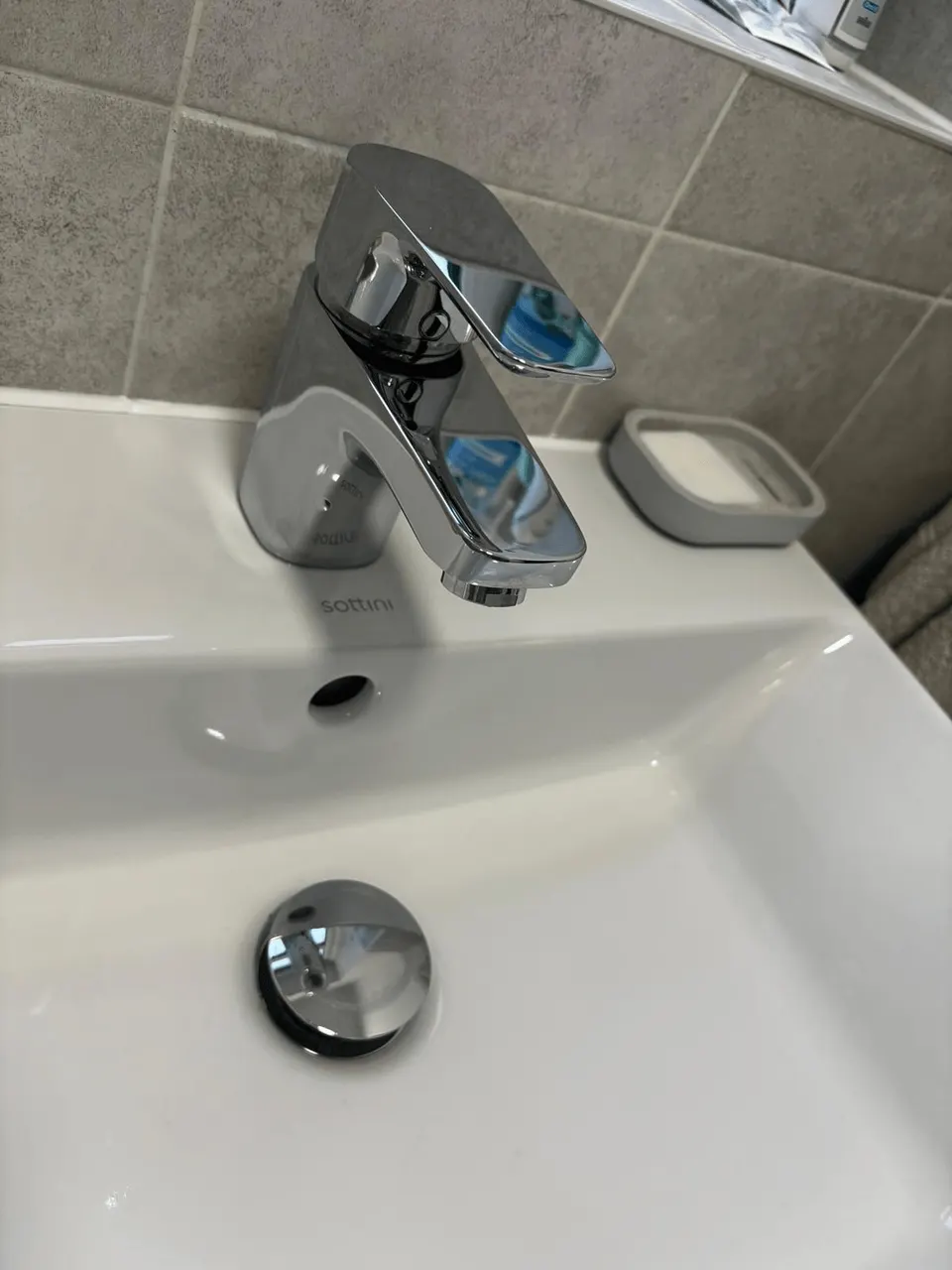 The same basin tap clean and shining after limescale removal