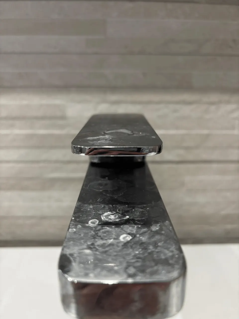 Chrome basin tap covered in limescale before cleaning